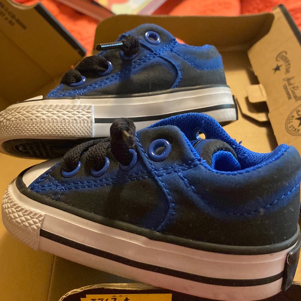 Blue and black infant converse.